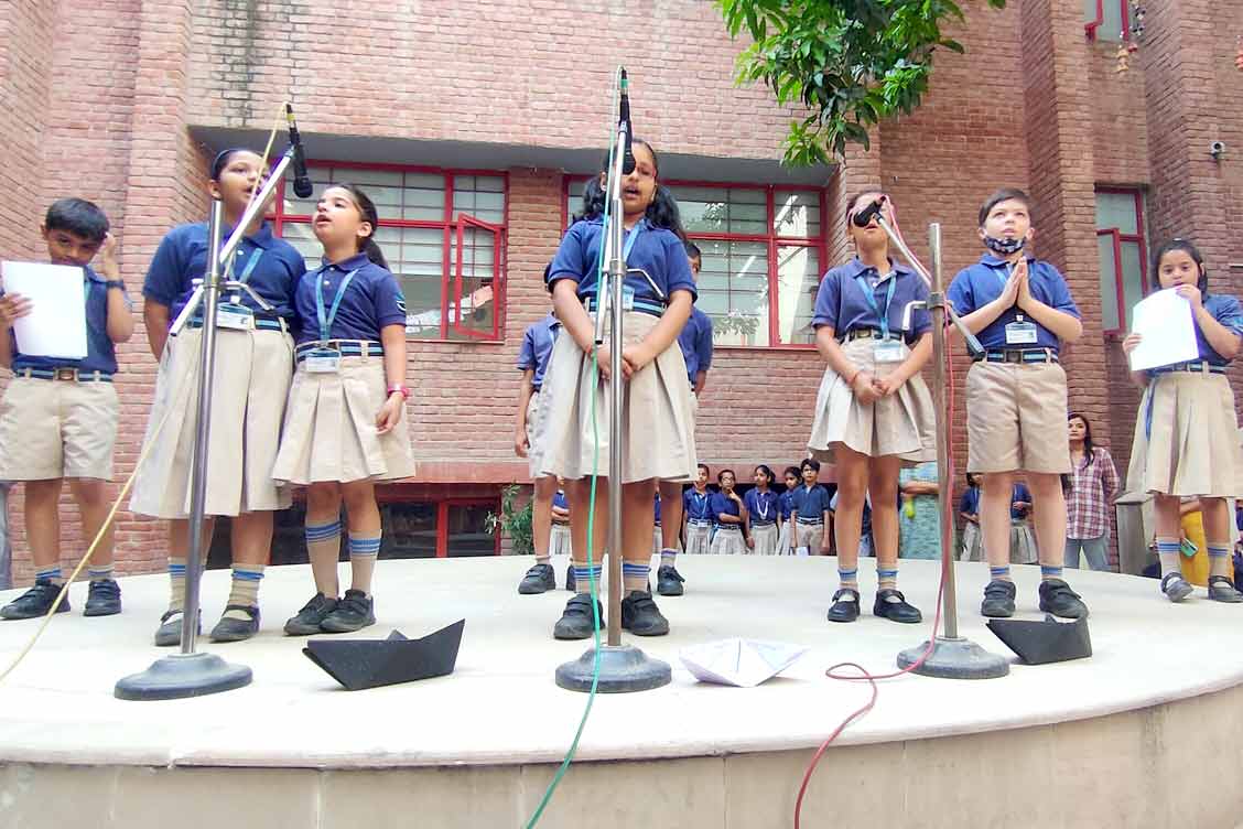Class assembly 4A at TKS around the theme My School